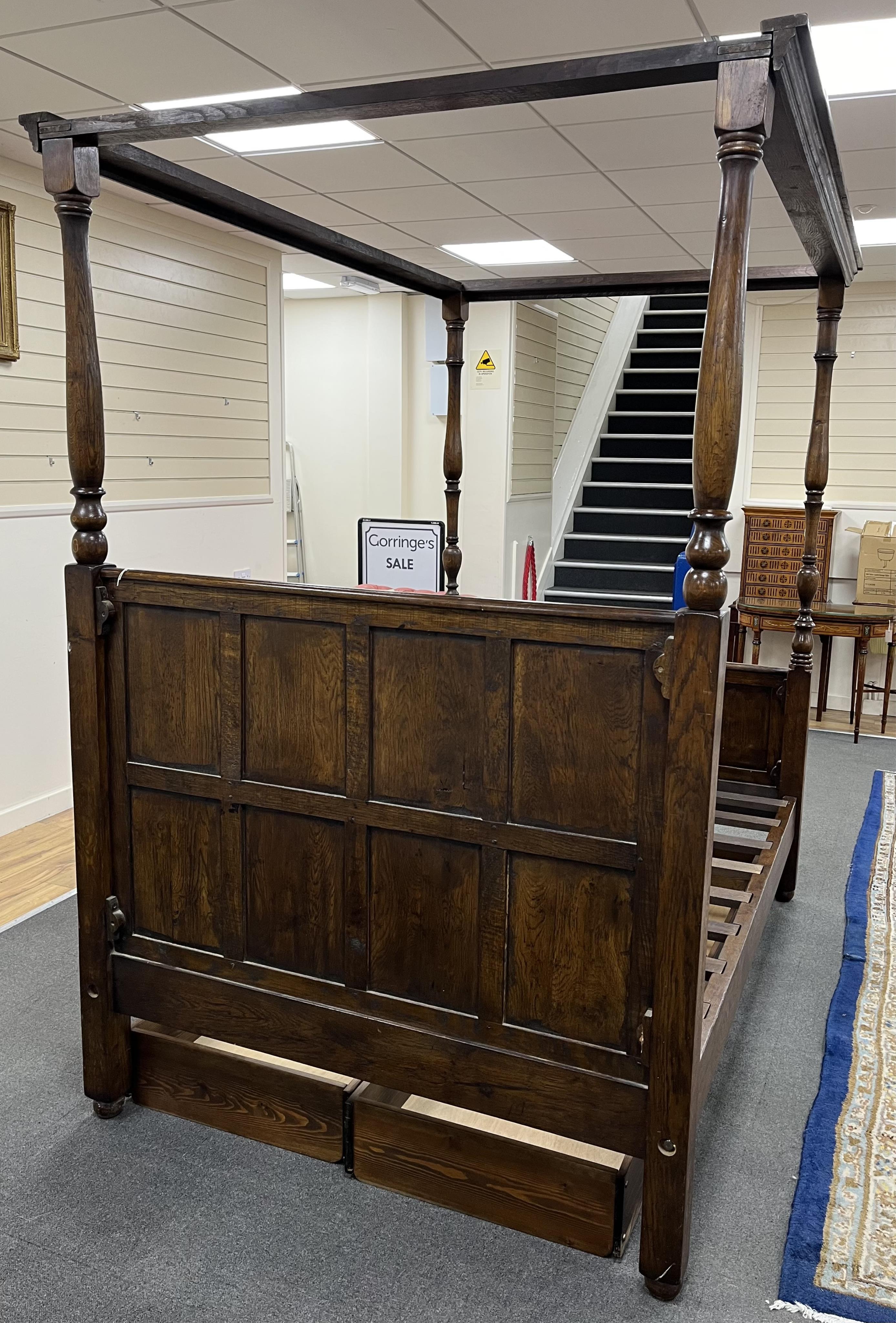 A reproduction 17th century style oak four poster bed frame, width 140cm, length 210cm, height 223cm. Condition - good